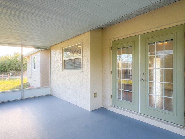 unfurnished sunroom with french doors and plenty of natural light