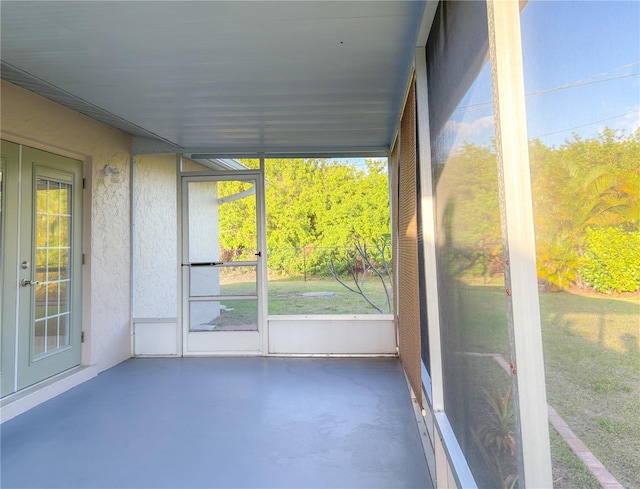unfurnished sunroom featuring french doors