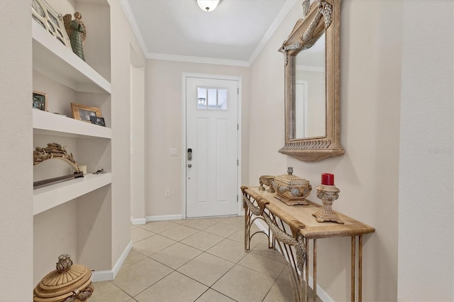 entryway featuring light tile patterned flooring, ornamental molding, and baseboards
