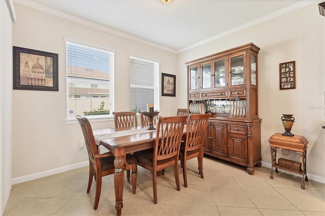 dining area with baseboards, light tile patterned floors, and ornamental molding
