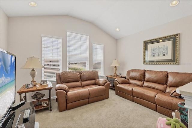 carpeted living area with recessed lighting and lofted ceiling