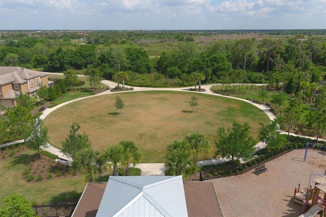 birds eye view of property featuring a forest view