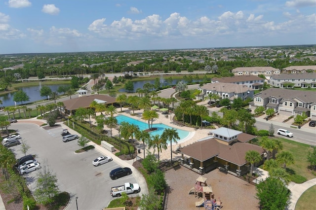 bird's eye view featuring a residential view and a water view