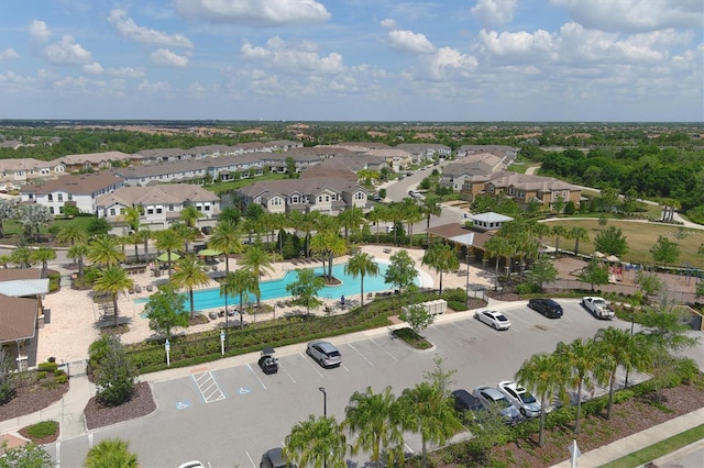 birds eye view of property with a residential view