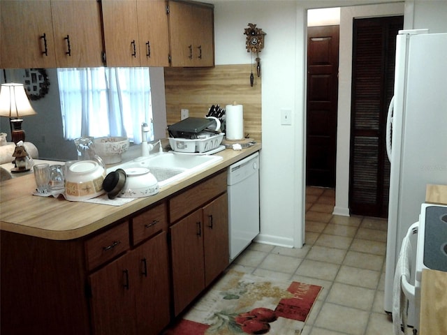 3 Lakeside Dr, Ocala, FL 34482 - kitchen with white appliances, light countertops, decorative backsplash, and light tile patterned floors