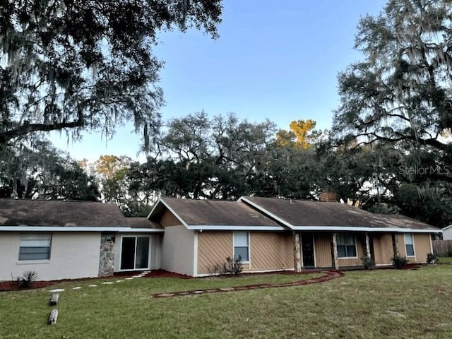 3 Lakeside Dr, Ocala, FL 34482 - view of front of home featuring a front lawn and a chimney