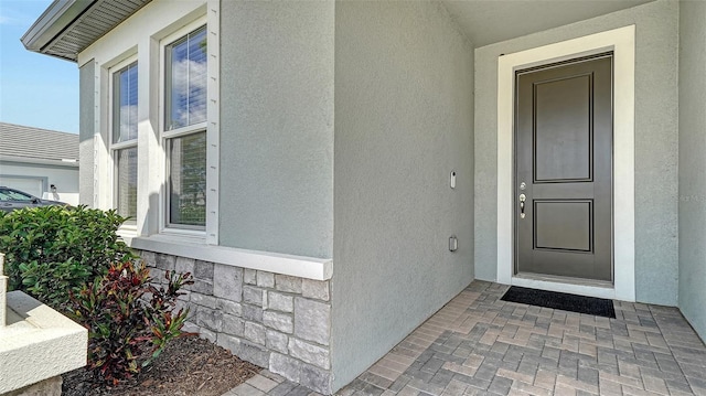 4725 Antrim Dr, Sarasota, FL 34240 - doorway to property with stucco siding