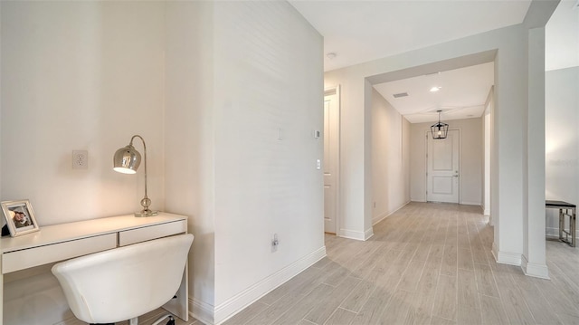 4725 Antrim Dr, Sarasota, FL 34240 - hallway with light wood-type flooring, baseboards, and an office area