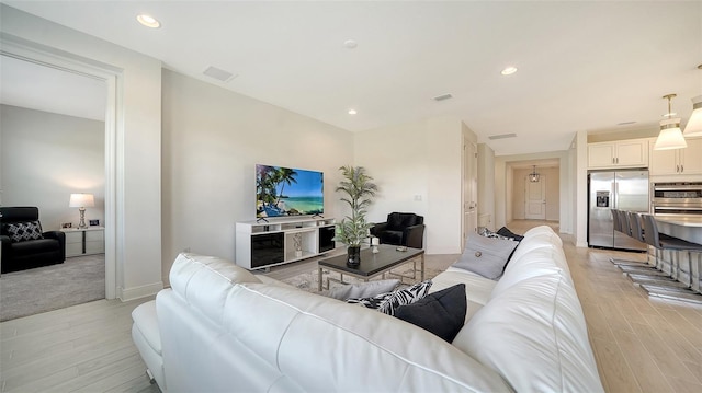 4725 Antrim Dr, Sarasota, FL 34240 - living area featuring light wood-style floors, recessed lighting, and baseboards