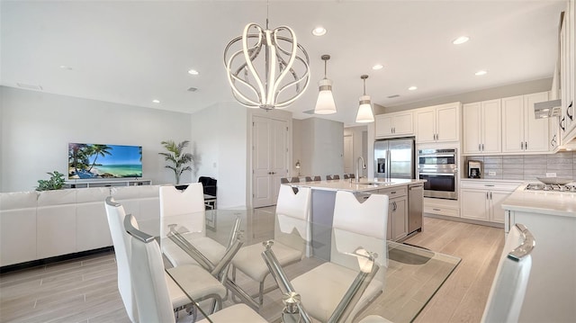 4725 Antrim Dr, Sarasota, FL 34240 - dining room with light wood-type flooring, recessed lighting, and a chandelier