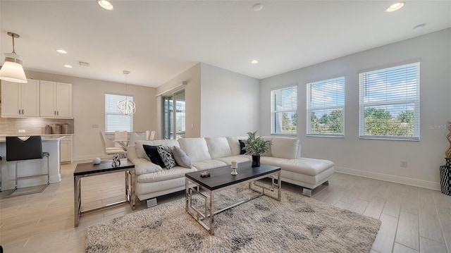 4725 Antrim Dr, Sarasota, FL 34240 - living room featuring healthy amount of natural light, light wood-type flooring, baseboards, and recessed lighting