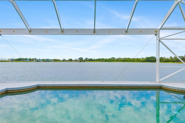 pool with a water view and glass enclosure