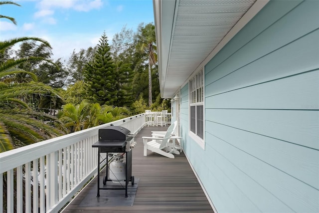 104 29th St Unit 3, Holmes Beach, FL 34217 - wooden terrace featuring a grill