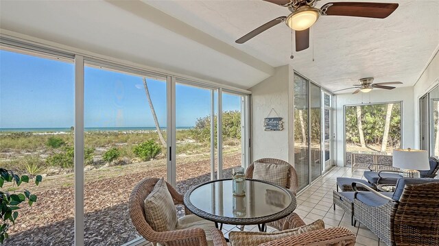 6951 Gulf Of Mexico Dr Unit 14, Longboat Key, FL 34228 - sunroom / solarium featuring a ceiling fan and a water view