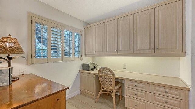 6951 Gulf Of Mexico Dr Unit 14, Longboat Key, FL 34228 - office with light wood-style flooring, built in desk, and baseboards