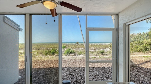 6951 Gulf Of Mexico Dr Unit 14, Longboat Key, FL 34228 - unfurnished sunroom with a water view and a view of the beach