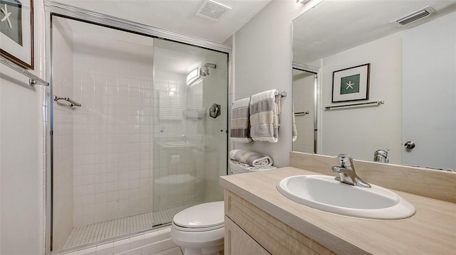 6951 Gulf Of Mexico Dr Unit 14, Longboat Key, FL 34228 - bathroom featuring toilet, a stall shower, vanity, and visible vents