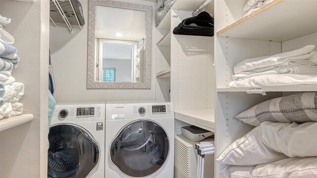 6951 Gulf Of Mexico Dr Unit 14, Longboat Key, FL 34228 - clothes washing area with laundry area and washing machine and dryer