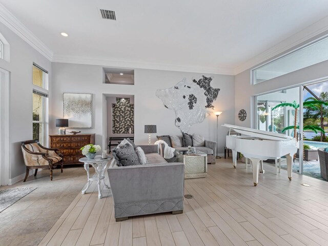8687 Woodbriar Dr, Sarasota, FL 34238 - living room with plenty of natural light, ornamental molding, recessed lighting, and light wood-style flooring