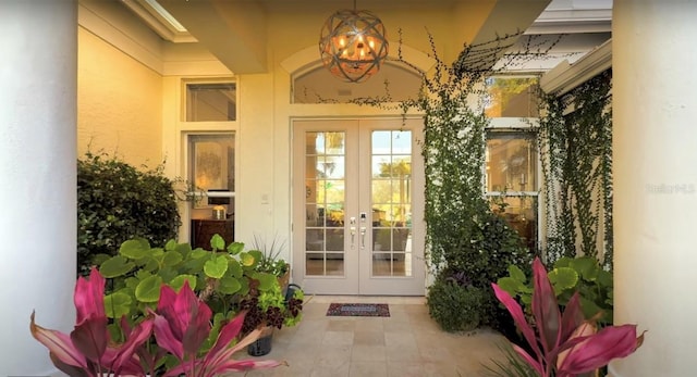 8687 Woodbriar Dr, Sarasota, FL 34238 - doorway to property with french doors and stucco siding