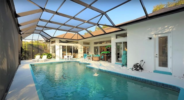 8687 Woodbriar Dr, Sarasota, FL 34238 - outdoor pool with a patio area, a ceiling fan, and glass enclosure
