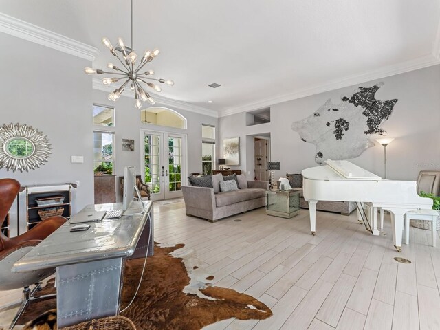 8687 Woodbriar Dr, Sarasota, FL 34238 - living room featuring french doors, crown molding, a chandelier, and light wood-type flooring