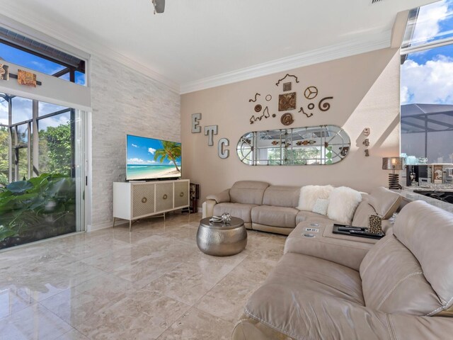 8687 Woodbriar Dr, Sarasota, FL 34238 - living area featuring marble tiled floors and ornamental molding