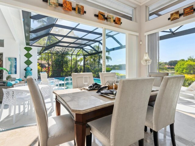 8687 Woodbriar Dr, Sarasota, FL 34238 - view of patio / terrace featuring outdoor dining area, glass enclosure, and a water view