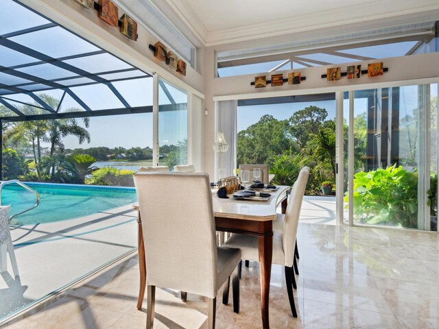 8687 Woodbriar Dr, Sarasota, FL 34238 - sunroom / solarium featuring ornamental molding and a water view