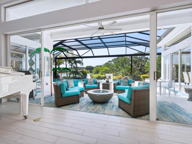 8687 Woodbriar Dr, Sarasota, FL 34238 - view of patio featuring an outdoor living space with a fire pit
