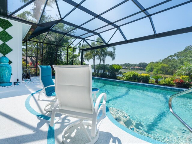 8687 Woodbriar Dr, Sarasota, FL 34238 - swimming pool featuring a patio and glass enclosure