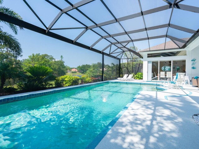8687 Woodbriar Dr, Sarasota, FL 34238 - outdoor pool with a patio area and a lanai
