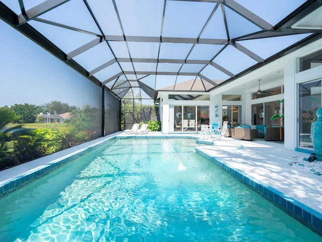 8687 Woodbriar Dr, Sarasota, FL 34238 - swimming pool featuring an outdoor hangout area, a patio area, a ceiling fan, and a lanai