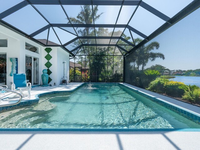 8687 Woodbriar Dr, Sarasota, FL 34238 - swimming pool featuring a patio, a lanai, and a water view