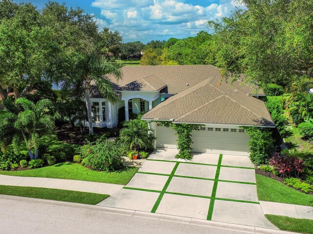 8687 Woodbriar Dr, Sarasota, FL 34238 - single story home with a garage and concrete driveway
