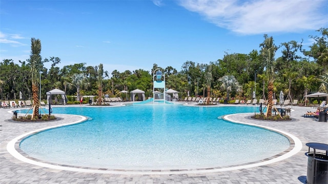 8355 Velda Trl, Sarasota, FL 34241 - community pool featuring view of scattered trees and a patio area