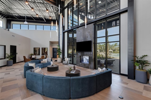 8355 Velda Trl, Sarasota, FL 34241 - living room featuring a high ceiling and a premium fireplace