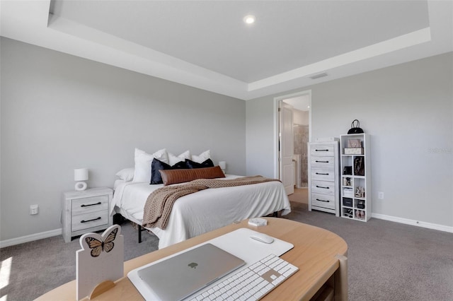 8355 Velda Trl, Sarasota, FL 34241 - bedroom featuring carpet, a tray ceiling, an office area, recessed lighting, and ensuite bath