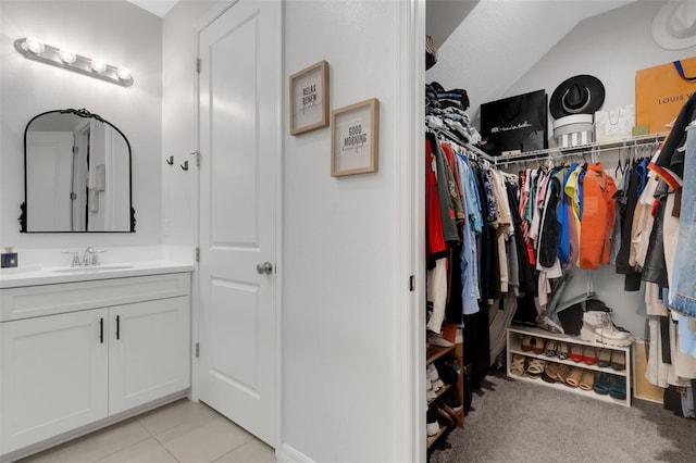 8355 Velda Trl, Sarasota, FL 34241 - walk in closet with vaulted ceiling and light tile patterned floors