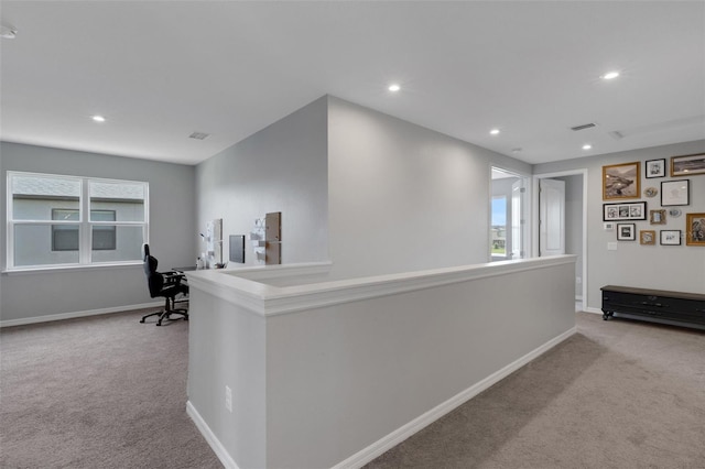 8355 Velda Trl, Sarasota, FL 34241 - hallway with carpet, recessed lighting, a desk, and healthy amount of natural light