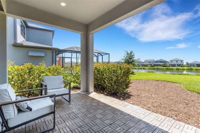 8355 Velda Trl, Sarasota, FL 34241 - view of patio featuring a water view, glass enclosure, and a residential view