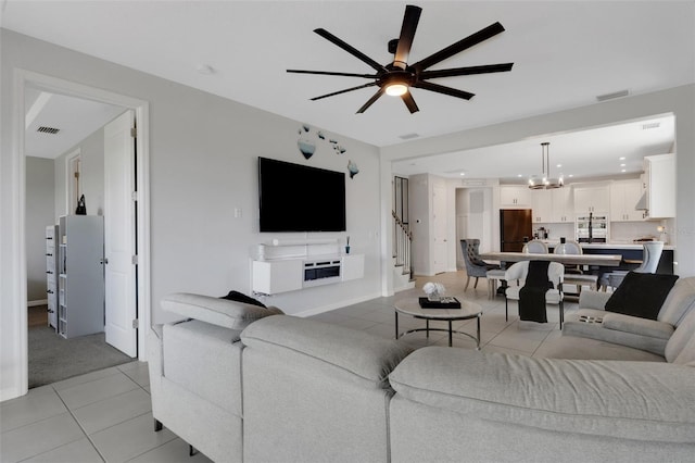 8355 Velda Trl, Sarasota, FL 34241 - living area featuring light tile patterned flooring, ceiling fan, heating unit, a chandelier, and recessed lighting
