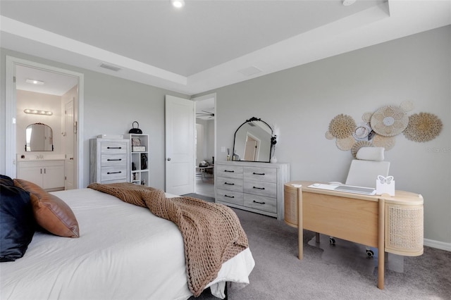 8355 Velda Trl, Sarasota, FL 34241 - bedroom featuring an office area, carpet, a tray ceiling, and ensuite bathroom