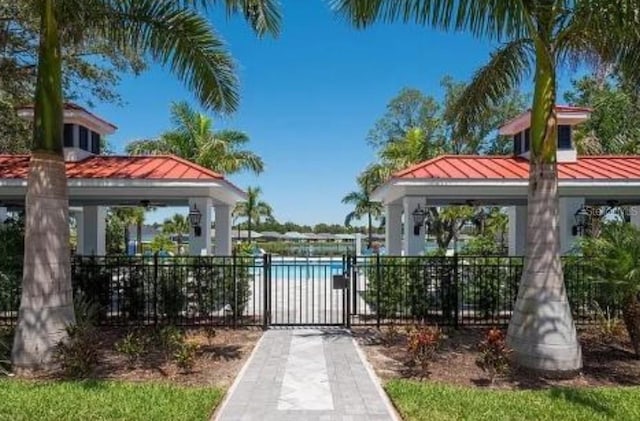 view of gate featuring a gazebo and fence