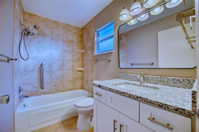 bathroom with tile patterned floors, vanity, shower / tub combination, and toilet