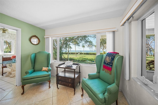 living area with a healthy amount of sunlight and tile patterned flooring