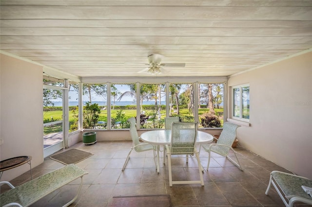 sunroom with wood ceiling and tile patterned flooring