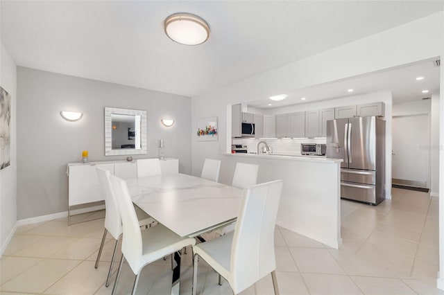 6940 W Country Club Dr N Unit V-77, Sarasota, FL 34243 - dining area featuring recessed lighting, a toaster, baseboards, and light tile patterned flooring