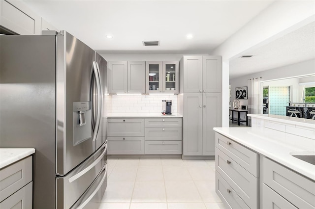 6940 W Country Club Dr N Unit V-77, Sarasota, FL 34243 - kitchen featuring gray cabinets, stainless steel refrigerator with ice dispenser, and visible vents