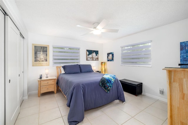 6940 W Country Club Dr N Unit V-77, Sarasota, FL 34243 - bedroom featuring a textured ceiling, a closet, and multiple windows